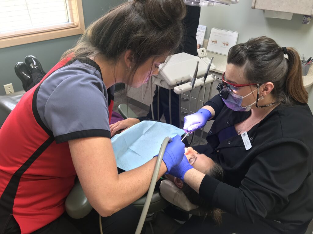 Cassandra and Lisa delivering an Invisalign case.