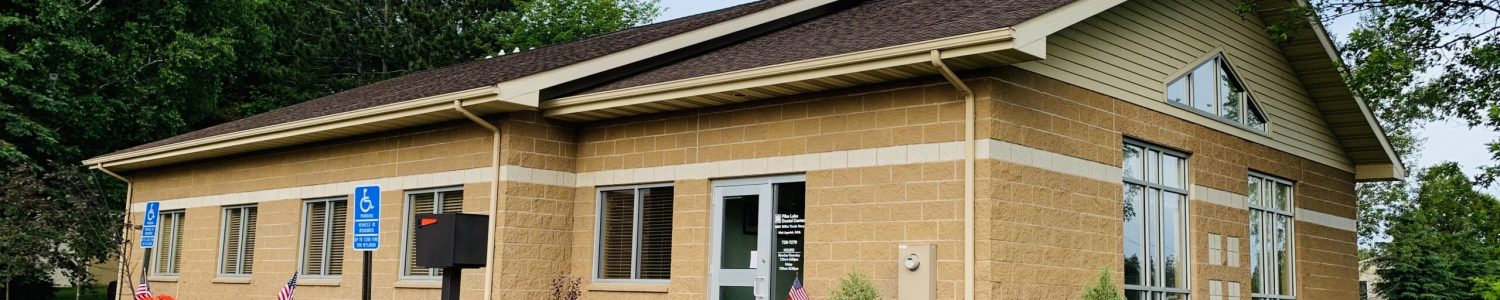 Office front with blue sky